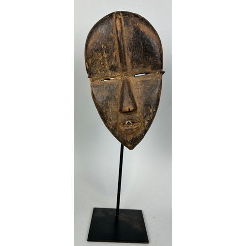 609 - AN AFRICAN TRIBAL MASK, 

23cm x 13cm 

Mounted on stand 38cm