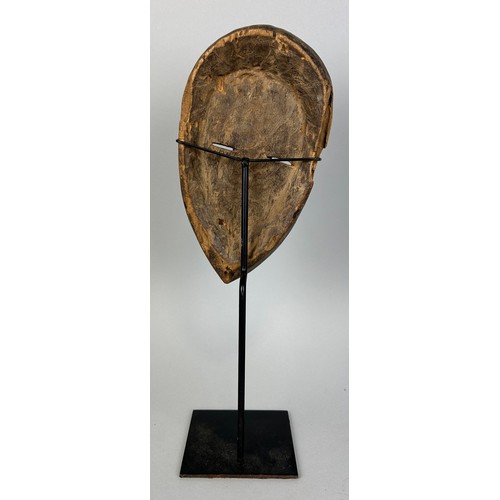 609 - AN AFRICAN TRIBAL MASK, 

23cm x 13cm 

Mounted on stand 38cm