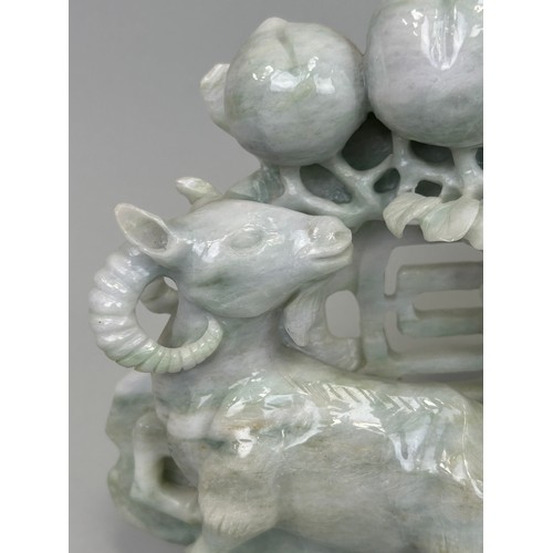 94 - A LARGE CHINESE CARVED JADE GROUP DEPICTING GOATS, 

26cm x 22cm