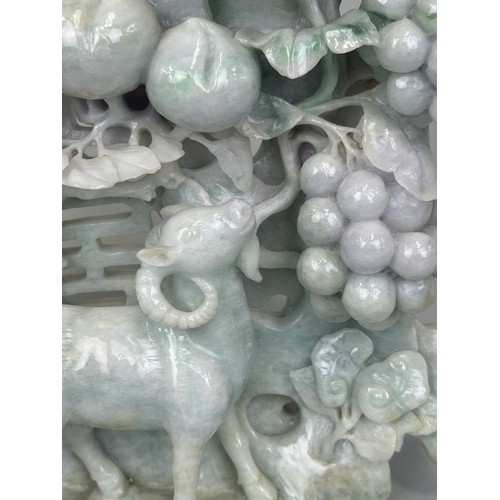 94 - A LARGE CHINESE CARVED JADE GROUP DEPICTING GOATS, 

26cm x 22cm