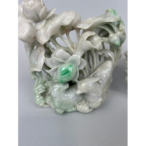 95 - A PAIR OF CHINESE CARVED JADE GROUPS DEPICTING BIRDS AND FLOWERS,

18cm x 16cm 
18cm x 17cm