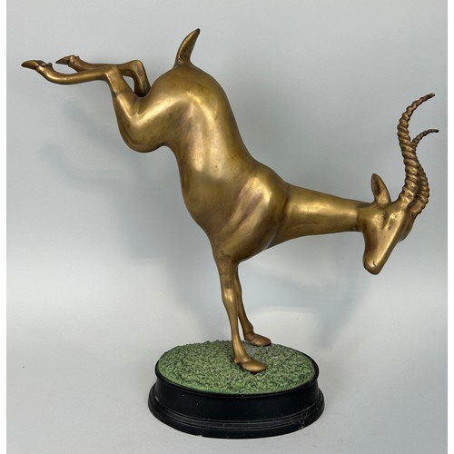 517 - A HOLLYWOOD REGENCY DESIGN BRONZE KUDU ON NATURALISTIC STAND, 

52cm x 44cm x 12cm