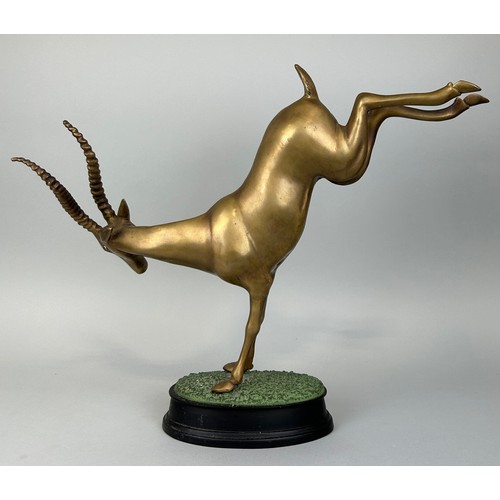 517 - A HOLLYWOOD REGENCY DESIGN BRONZE KUDU ON NATURALISTIC STAND, 

52cm x 44cm x 12cm