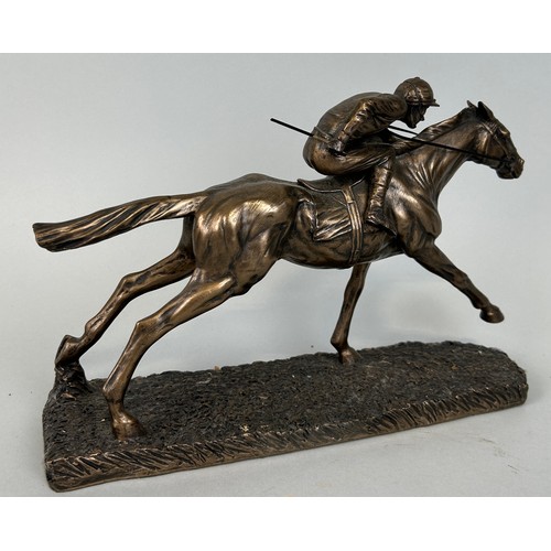 520 - A BRONZED METAL SCULPTURE DEPICTING A JOCKEY ON A RACEHORSE, 

28cm x 19cm