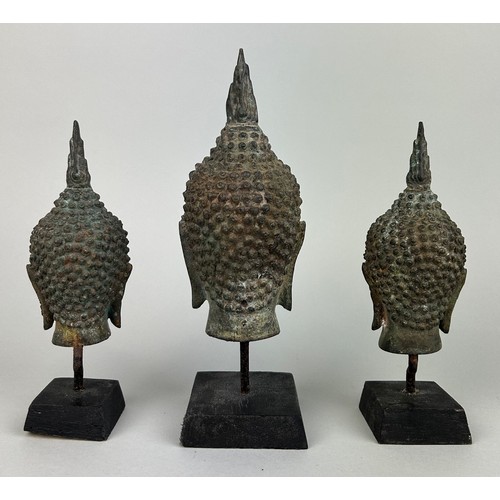 542 - A SET OF THREE THAI BRONZE BUDDHA'S POSSIBLY 18TH OR 19TH CENTURY, 

Each mounted on stand. 

Larges... 