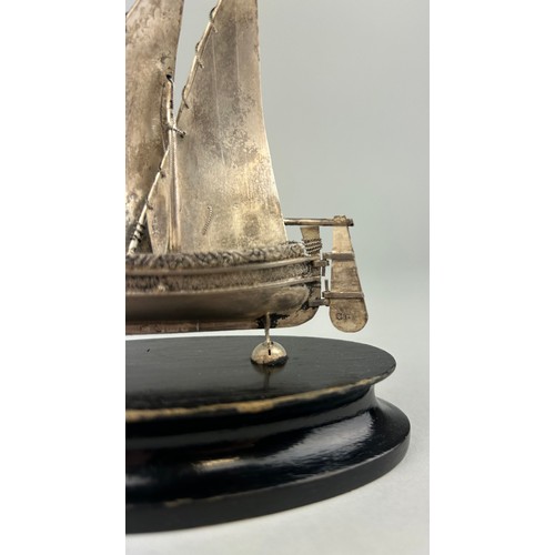 152 - A SILVER JUNK SHIP MOUNTED ON STAND, 

12cm x 12cm including stand.