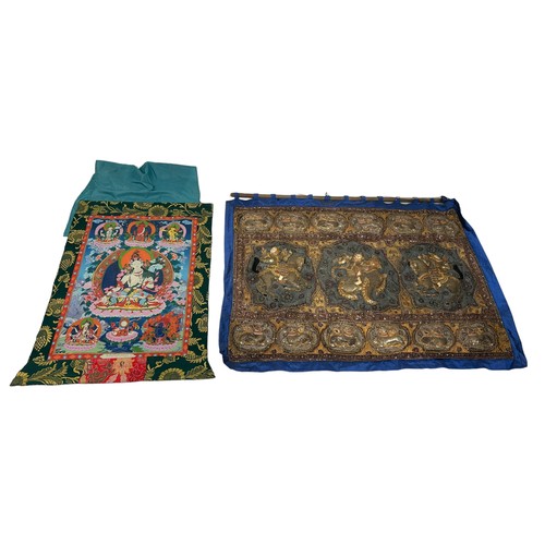 297 - A TIBETAN THANGKA ALONG WITH AN EMBROIDERED WALL HANGING (2) 

Largest 128cm x 97cm