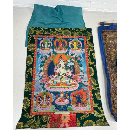 297 - A TIBETAN THANGKA ALONG WITH AN EMBROIDERED WALL HANGING (2) 

Largest 128cm x 97cm