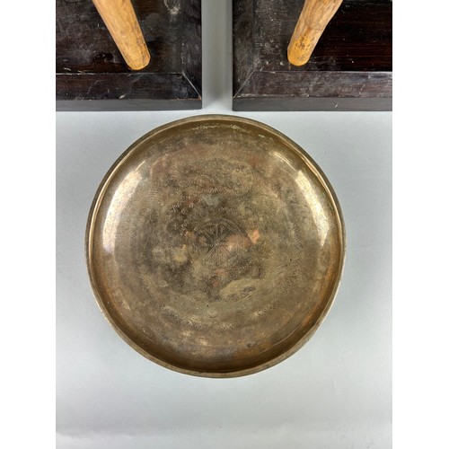 114 - A PAIR OF BUDDHIST BRONZE ELEPHANT BELLS OR GONGS AND A SINGING BOWL (3), 

Each gong 43cm x 38cm 

... 