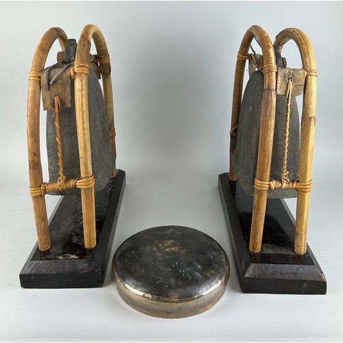 114 - A PAIR OF BUDDHIST BRONZE ELEPHANT BELLS OR GONGS AND A SINGING BOWL (3), 

Each gong 43cm x 38cm 

... 