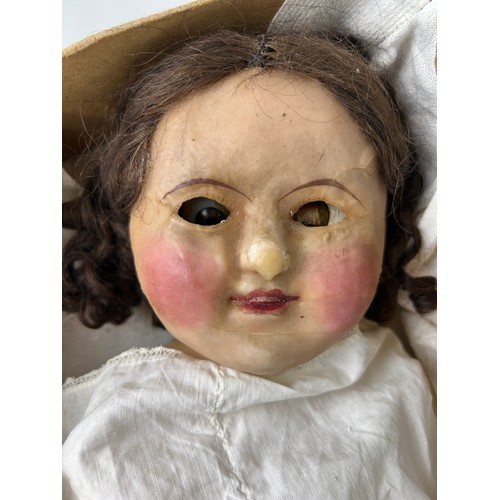 539 - A LATE 19TH OR EARLY 20TH CENTURY WAX DOLL, 

70cm L

Housed in Harrods box.