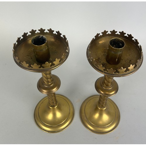 490 - AFTER AWN PUGIN: A PAIR OF GOTHIC BRASS CANDLESTICKS 

25cm H each.