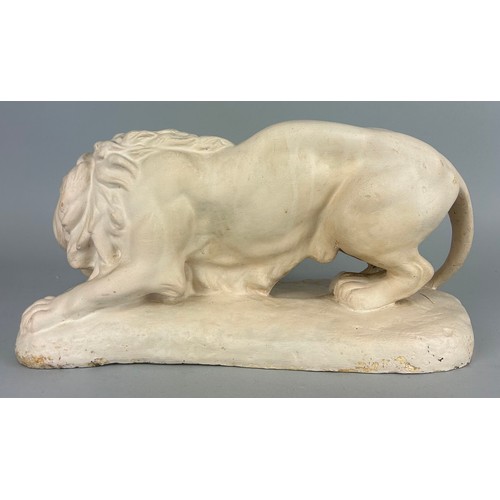 525 - A LARGE CLASSICAL STYLE PLASTER LION, 

42cm x 21cm