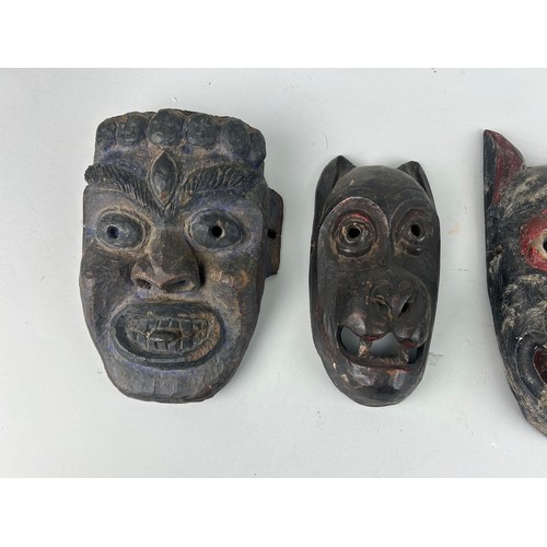 119 - A GROUP OF FOUR AFRICAN TRIBAL MASKS (4), 

Largest 27cm x 14cm