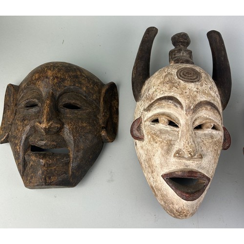 121A - A GROUP OF FOUR AFRICAN TRIBAL MASKS (4),