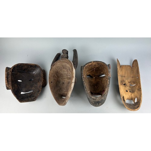 121A - A GROUP OF FOUR AFRICAN TRIBAL MASKS (4),