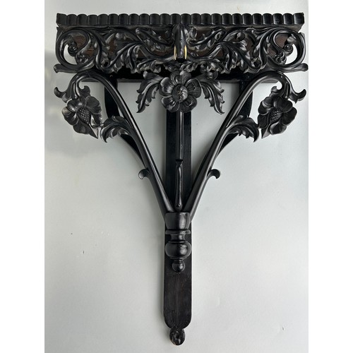 487 - AN EBONISED WOODEN WALL SHELF WITH ELEPHANT, 

52cm x 40cm

Ivory exemption license: VF1XCS3L