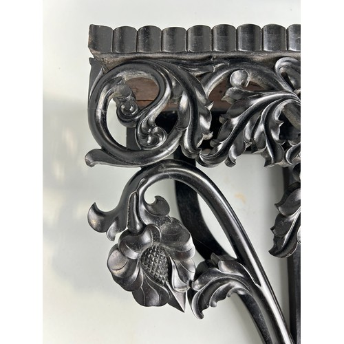 487 - AN EBONISED WOODEN WALL SHELF WITH ELEPHANT, 

52cm x 40cm

Ivory exemption license: VF1XCS3L