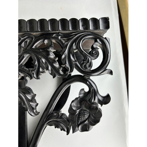 487 - AN EBONISED WOODEN WALL SHELF WITH ELEPHANT, 

52cm x 40cm

Ivory exemption license: VF1XCS3L