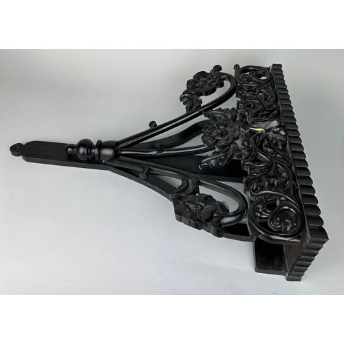 487 - AN EBONISED WOODEN WALL SHELF WITH ELEPHANT, 

52cm x 40cm

Ivory exemption license: VF1XCS3L