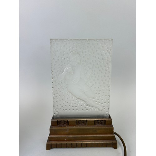 489 - AN ART DECO VERLYS PRESSED GLASS LIGHT ON STAND IN THE FORM OF A RUGBY PLAYER, 

30cm x 19cm