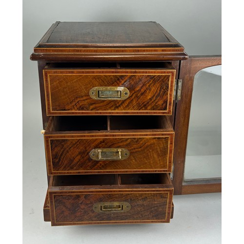 458A - A 19TH CENTURY ROSEWOOD TABLE TOP CABINET WITH GLAZED FRONT AND THREE DRAWERS WITH CAMPAIGN HANDLES