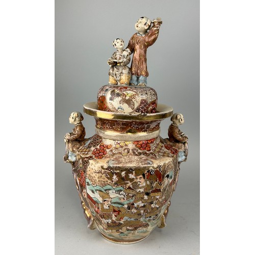 142 - A LARGE 19TH CENTURY JAPANESE SATSUMA VASE AND COVER,
 
Handles and finials formed as children. 

58... 