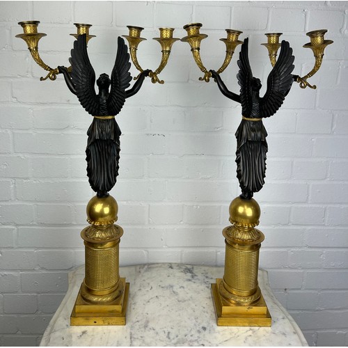 441 - A PAIR OF FRENCH EMPIRE DESIGN EARLY 20TH CENTURY GILT AND BRONZE FOUR-LIGHT CANDELABRA IN THE MANNE... 