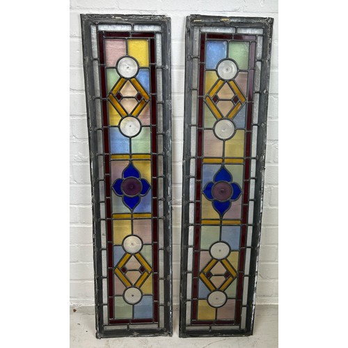 584 - A PAIR OF STAINED GLASS PANELS FROM A LOCAL WIMBLEDON PROPERTY, 

100cm x 25cm each.