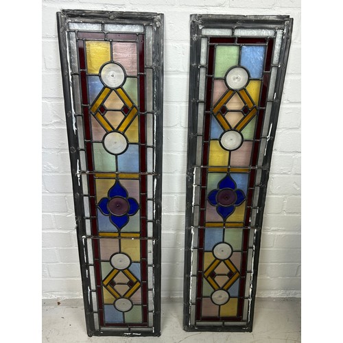 584 - A PAIR OF STAINED GLASS PANELS FROM A LOCAL WIMBLEDON PROPERTY, 

100cm x 25cm each.