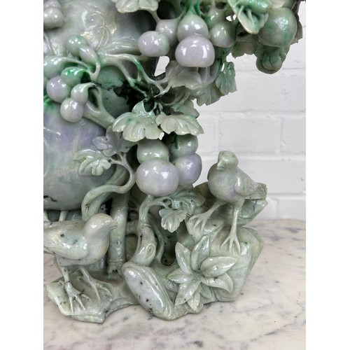 98 - A LARGE JADE SCULPTURAL GROUP DEPICTING BIRDS AMONGST FOLIAGE, 

40cm x 36cm