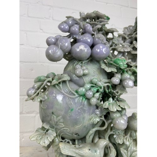 98 - A LARGE JADE SCULPTURAL GROUP DEPICTING BIRDS AMONGST FOLIAGE, 

40cm x 36cm