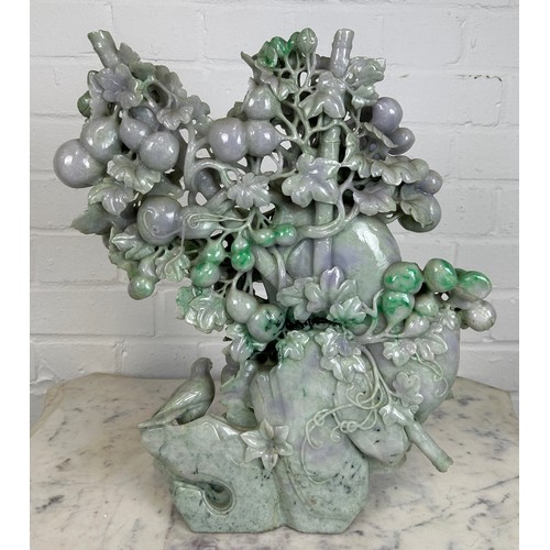 98 - A LARGE JADE SCULPTURAL GROUP DEPICTING BIRDS AMONGST FOLIAGE, 

40cm x 36cm