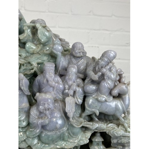 99 - A LARGE AND EXCEPTIONALLY HEAVY CHINESE GREEN AND PURPLE JADE SCULPTURE DEPICTING SEVERAL FIGURES WI... 