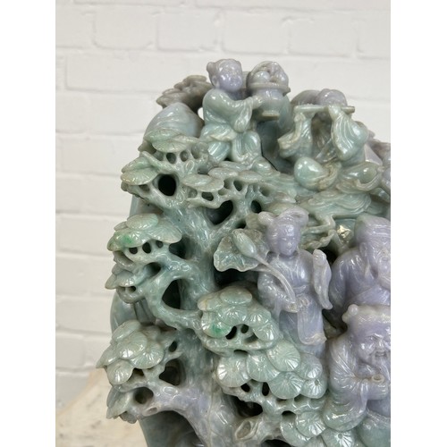 99 - A LARGE AND EXCEPTIONALLY HEAVY CHINESE GREEN AND PURPLE JADE SCULPTURE DEPICTING SEVERAL FIGURES WI... 