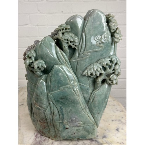 99 - A LARGE AND EXCEPTIONALLY HEAVY CHINESE GREEN AND PURPLE JADE SCULPTURE DEPICTING SEVERAL FIGURES WI... 