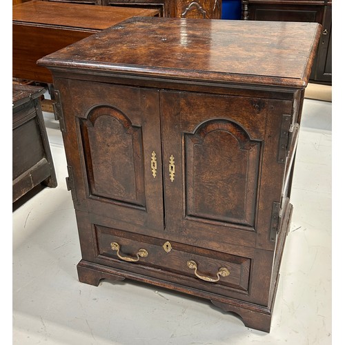 459 - A 19TH CENTURY OAK CABINET, 

Two doors over a single drawer, with shelves.