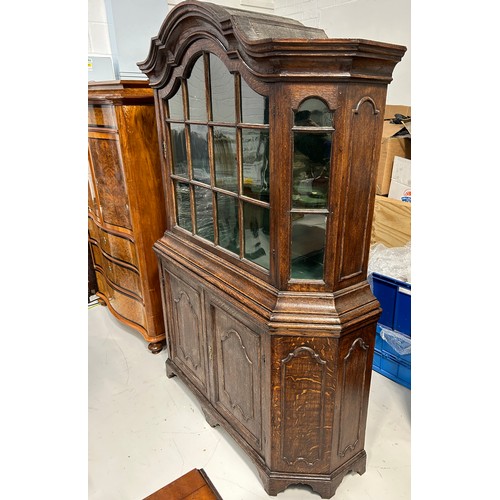 413 - A LARGE 19TH CENTURY OAK DRESSER WITH GLAZED GLASS PANELS OVER TWO DOORS,

Green lined interior and ... 