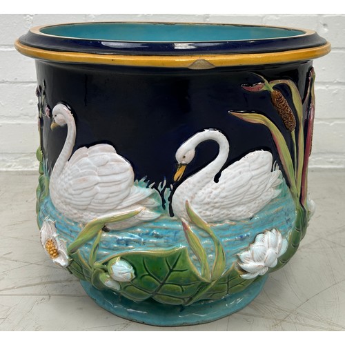 473 - A GEORGE JONES MAJOLICA JARDINIERE DECORATED WITH SWANS, 

37cm x 30cm