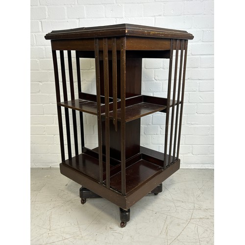 443 - AN EDWARDIAN SHERATON REVIVAL TWO TIER REVOLVING BOOKCASE WITH MARQUETRY INLAID PATERA, 

90cm x 49c... 