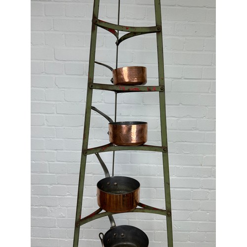 410B - A GRADUATED SET OF SIX COPPER PANS ON GREEN PAINTED IRON STAND, 

Stand 182cm H

Largest pan 22cm x ... 