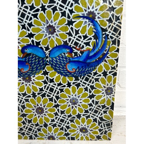 532 - A PERSIAN TILE DECORATED WITH BIRDS AND FLOWERS, 

49cm x 34cm