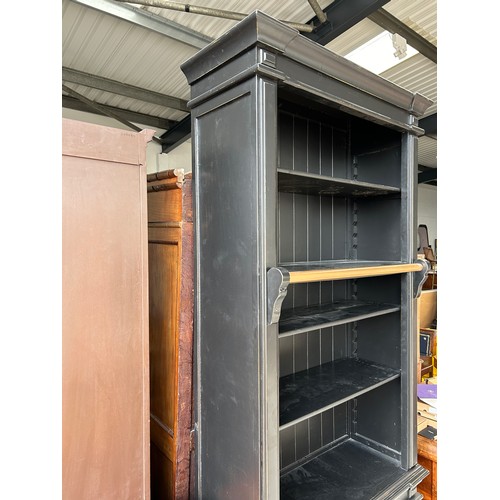 512 - A TALL EBONISED SECTIONAL BOOKCASE, 

240cm x 100cm x 40cm