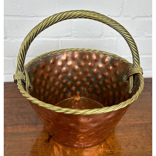 533 - AN ARTS AND CRAFTS COPPER BASKET WITH ROPE TWIST HANDLES 

34cm x 32cm