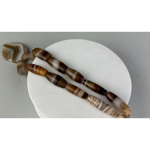 12 - A WESTERN ASIATIC BANDED AGATE BEAD NECKLACE CIRCA 3RD MILLENIUM B.C. / 2ND CENTURY A.D. ALONG WITH ... 