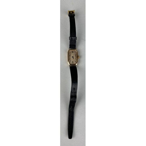 187 - AN ANTIQUE 9CT GOLD WATCH WITH BLACK LEATHER STRAP, 

Weight 12.9gms