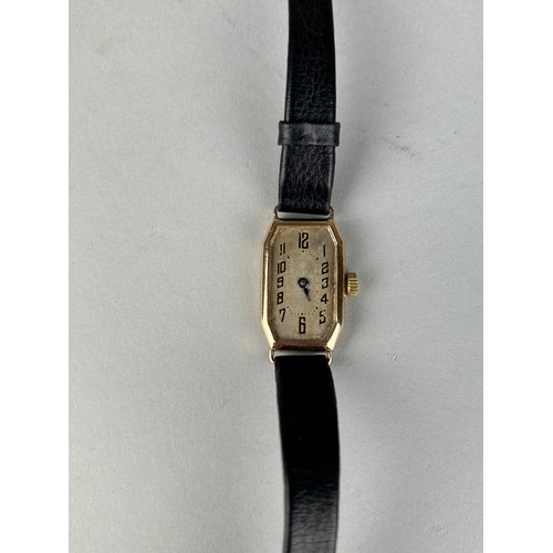 187 - AN ANTIQUE 9CT GOLD WATCH WITH BLACK LEATHER STRAP, 

Weight 12.9gms