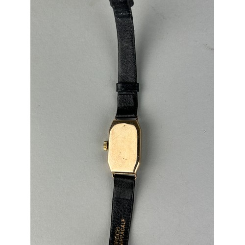 187 - AN ANTIQUE 9CT GOLD WATCH WITH BLACK LEATHER STRAP, 

Weight 12.9gms