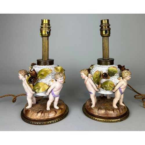 484 - A PAIR OF DRESDEN PORCELAIN TABLE LAMPS, DEPICTING WINGED PUTTI, FLORA AND FAUAN, 

29cm H each.