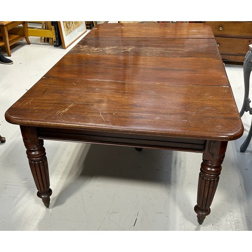 444 - A LARGE WILLIAM IV DINING TABLE WITH TWO LEAFS RAISED ON TURNED LEGS AND CASTORS,

225cm x 120cm x 7... 